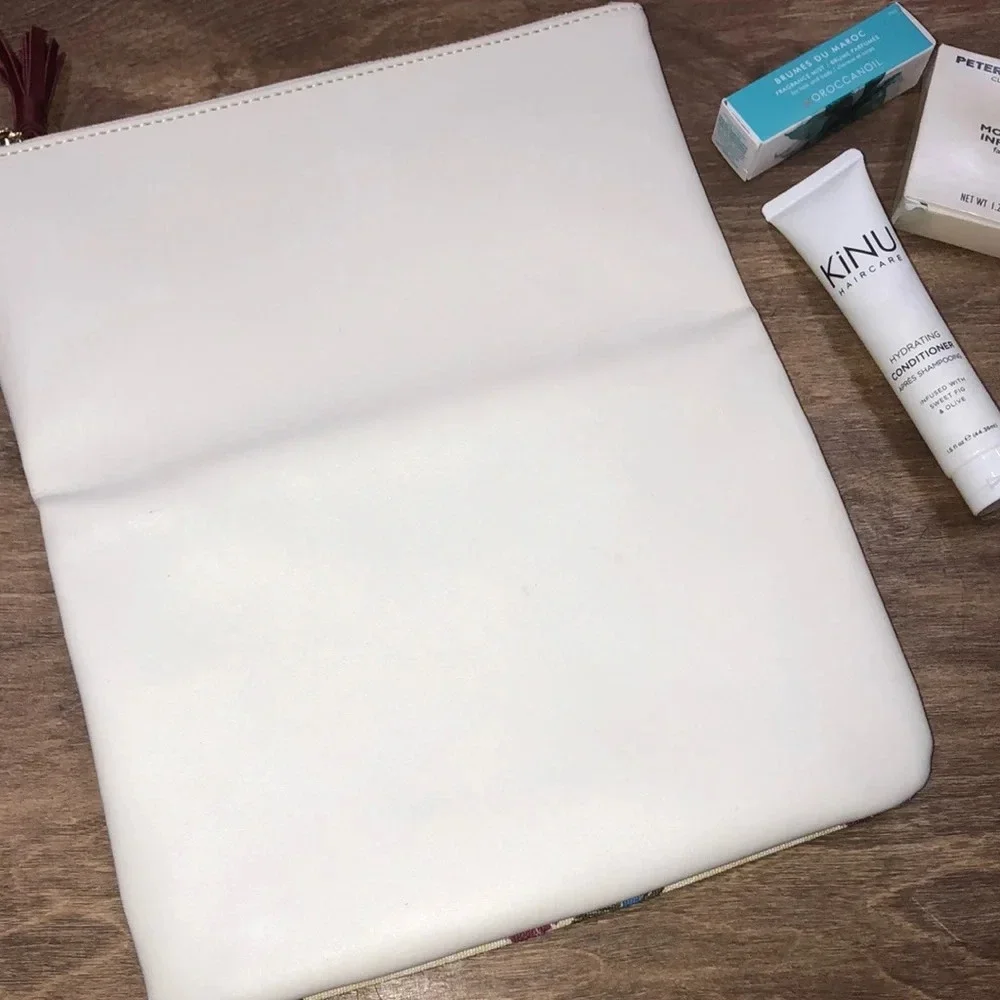 RACHEL Pally floral clutch with beauty samples